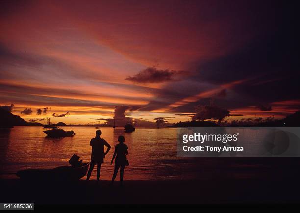 sunset over cane garden bay, british virgin islands - cane garden bay stock-fotos und bilder