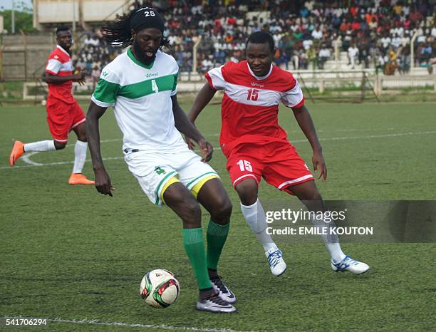 Togo national football team skipper Emmanuel Adebayor tries to controll the ball during an exhibition match to mourn former coach in Lome, on June...
