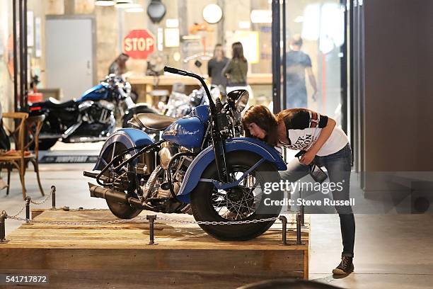 The 1948 EL Panhead is cleaned for the grand opening. The new Harley-Davidson showroom cafe on Ossington Avenue features a coffee bar, new and...