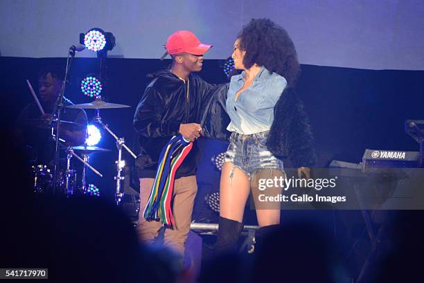 Hip Hop Star Emtee and Pearl Thusi perform during the Castle Lite Unlocks J. Cole concert at the Ticketpro Dome on June 18, 2016 in Johannesburg,...