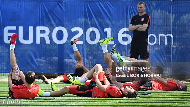 Poland's players warm up during a training session at the Robert-Louis Dreyfus stadium in Marseille, southern France, on June 20 a day ahead of their...