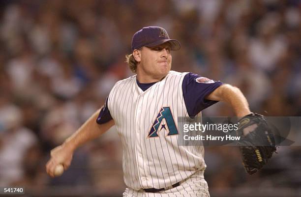 Curt Schilling of the Arizona Diamondbacks delivers in the top of the first inning against the New York Yankees during game seven of the Major League...