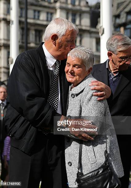 Jean Leadbeater, the mother of Labour MP Jo Cox, is embraced by her husband Gordon Leadbeater in Parliament Square after the service on June 20, 2016...