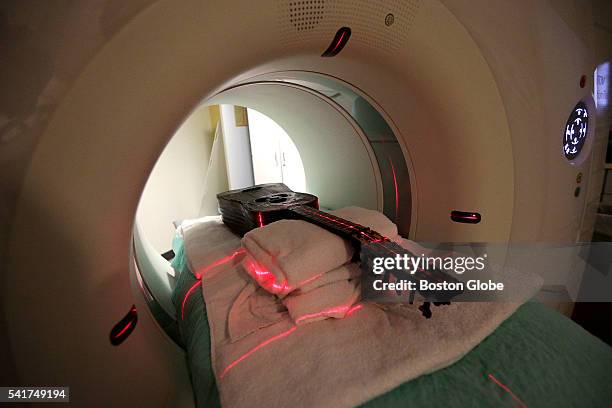 Rare guitar from the Isabella Stewart Gardner Museum is aligned in a CT machine at Mass. General Hospital in Boston on June 7, 2016. The museum is...