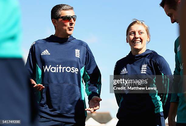 Mark Robinson, Head Coach of England talks to Heather Knight, captain of England during the 1st Royal London ODI match between England Women and...