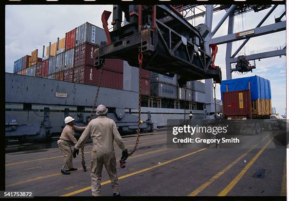 People Loading Ships Men work on the cargo area of a ship docked along the Houston Ship ...