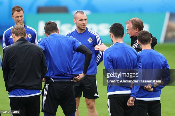 Michael O'Neill, head coach of Northern Ireland talks to his palyer during a team Northern Ireland training session ahead of the UEFA EURO 2016 Group...