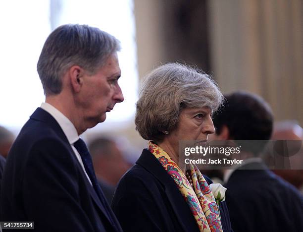 Secretary of State Philip Hammond and Home Secretary Theresa May attend the remembrance service for Jo Cox at St Margaret's church on June 20, 2016...