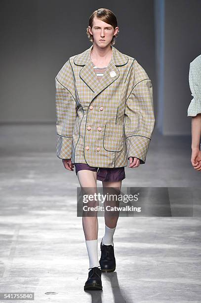 Model walks the runway at the Moto Guo Spring Summer 2017 fashion show during Milan Menswear Fashion Week on June 20, 2016 in Milan, Italy.