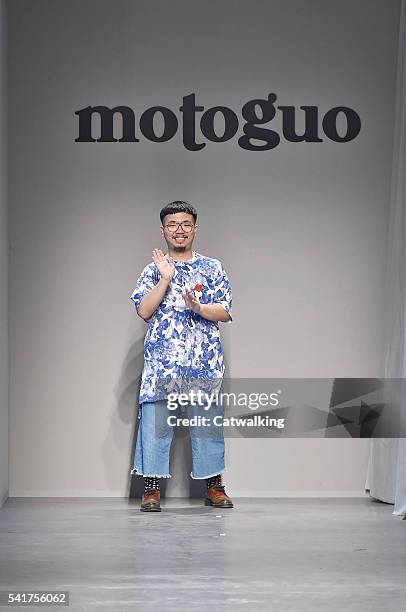 Fashion designer Moto Gui walks the runway at the Moto Guo Spring Summer 2017 fashion show during Milan Menswear Fashion Week on June 20, 2016 in...