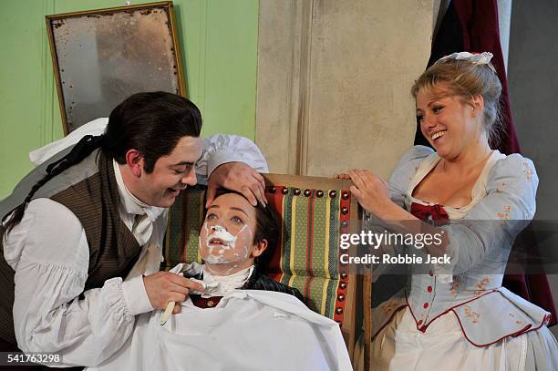 James Oldfield as Figaro, Anna Grevelius as Cherubino and Sophie Evans as Susanna in Garsington Opera's production of Wolfgang Amadeus Mozart's "Le...