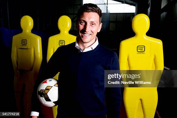 New signing Tommy Elphick of Aston Villa poses for a picture at the club's training ground at Bodymoor Heath on June 20, 2016 in Birmingham, England.