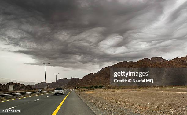 storm clouds near fujairah, uae - fujairah bildbanksfoton och bilder