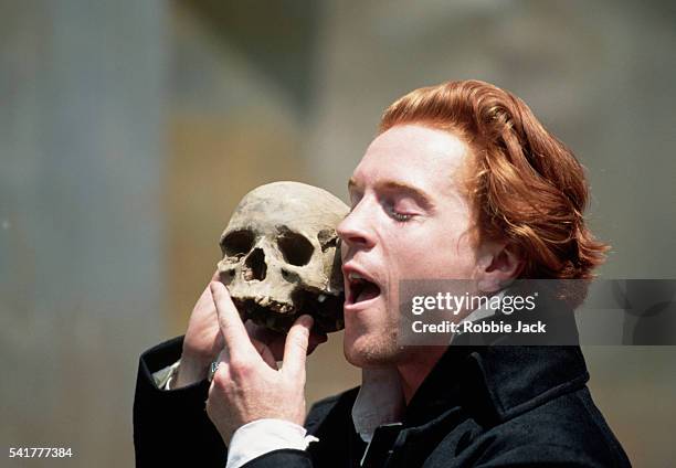 Damian Lewis, as Hamlet, reminisces about the dead jester Yorick in Act V, Scene i of an Open Air Theatre production of Hamlet. By: William...