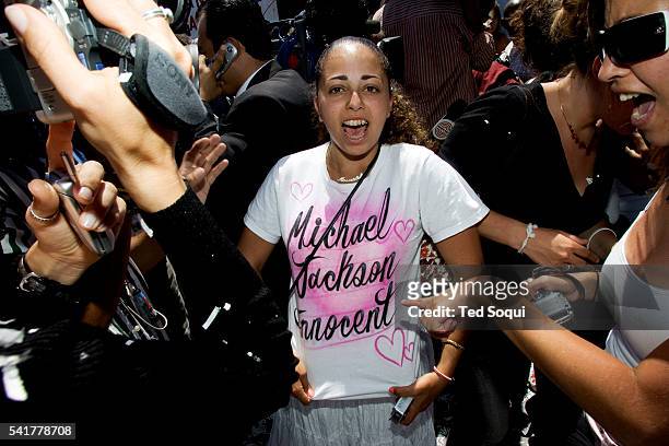 Fans of pop singer Michael Jackson celebrate the entertainer's "Not Guilty" verdict today during his child molestation trial at the Santa Barbara...