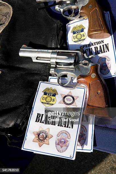 Handgun seized from a raid on the Mongols Motorcycle gang is on display during a press conference in Los Angeles. 61 members of the Mongols...