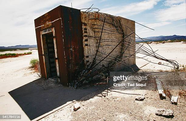 Destroyed bomb shelter. Located inside the Nevada nuclear test site is an area named Doom Town, a small 1950's style community. Several open air...
