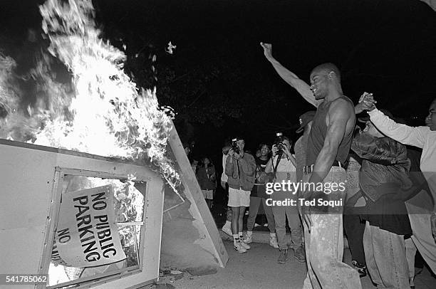 Rioters near Parker Center, LAPD headquarters in downtown Los Angeles, over turn a parking kiosk and set it ablaze. Los Angeles has undergone several...