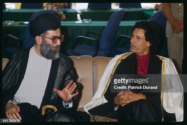 Libyan Statesman Moammar Kadhafi and Iranian President Ali Khamenei speak together at the eighth Summit of Non-Aligned Countries . Driven by the need...
