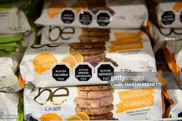 Cookies with labels stating their high content in sugar, calories and saturated fat, in Santiago, on June 20, 2016. A new law coming into force next...