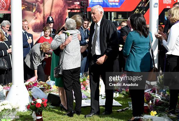 Jo Cox's parents Jean and Gordon look at the flowers left for their daughter in Parliament square following the remembrance service for Jo Cox at St...