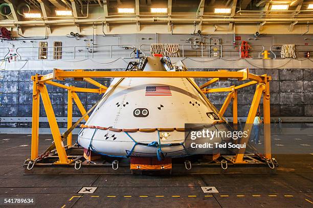 The new Orion space capsule from NASA that will carry astronauts to Mars and back. The USS Anchorage is practicing retrieving the capsule at sea....