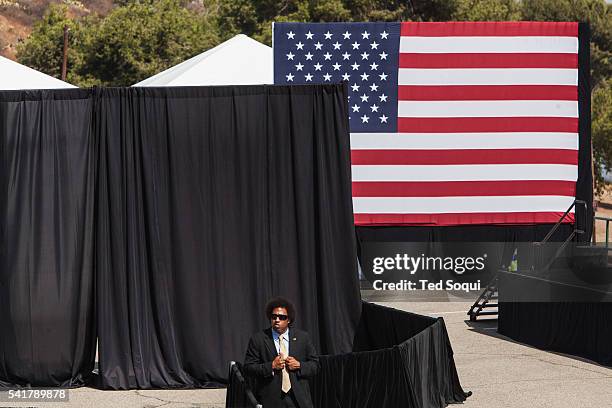 Secret service agent protects the stage where the President will speak. President Obama signed a declaration marking the mountains of San Gabriel in...