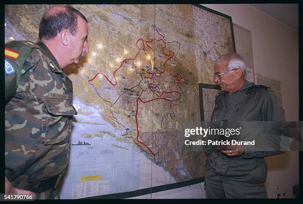 The French general Philippe Morillon looks at a map with a Spanish colonel, in the briefing room of his residence. General Morillon was United...