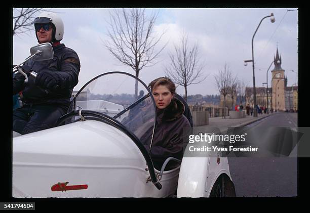 Czechoslovakian Model Paulina Nemcova sits in a vintage car.