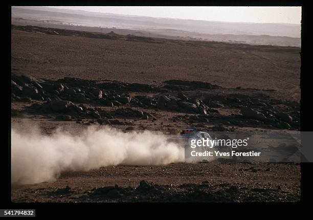 French driver Hubert Auriol's buggy passes through the African desert during the 12th Paris-Dakar rally.