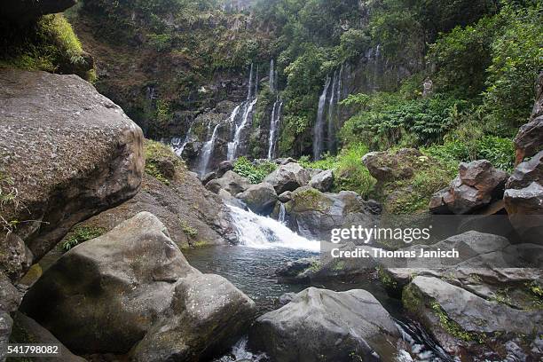 cascades at the grand galet waterfall, langevin river valley, reunion island - galet stockfoto's en -beelden