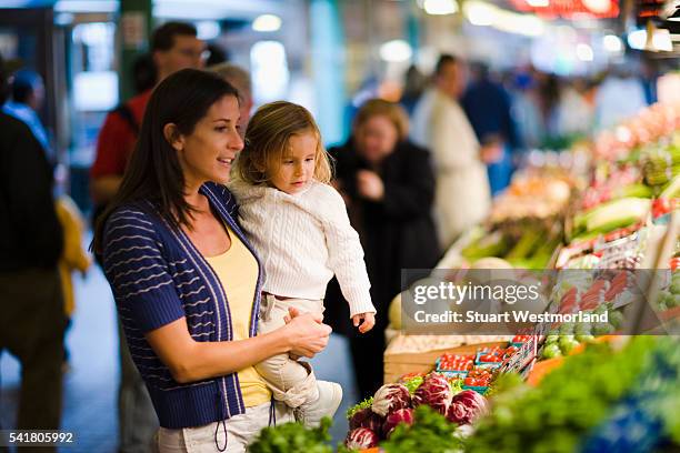 mother and daughter at pike place market - seattle market stock pictures, royalty-free photos & images