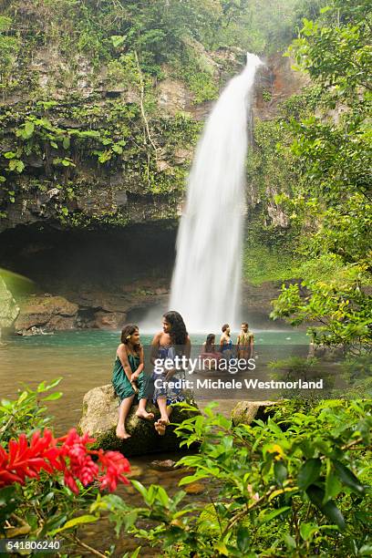 people cooling off at bouma falls - fiji people stock pictures, royalty-free photos & images