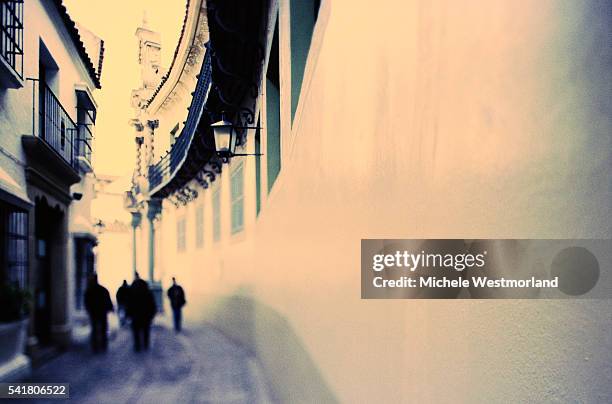 blurred figures in spanish street - poble espanyol stock pictures, royalty-free photos & images