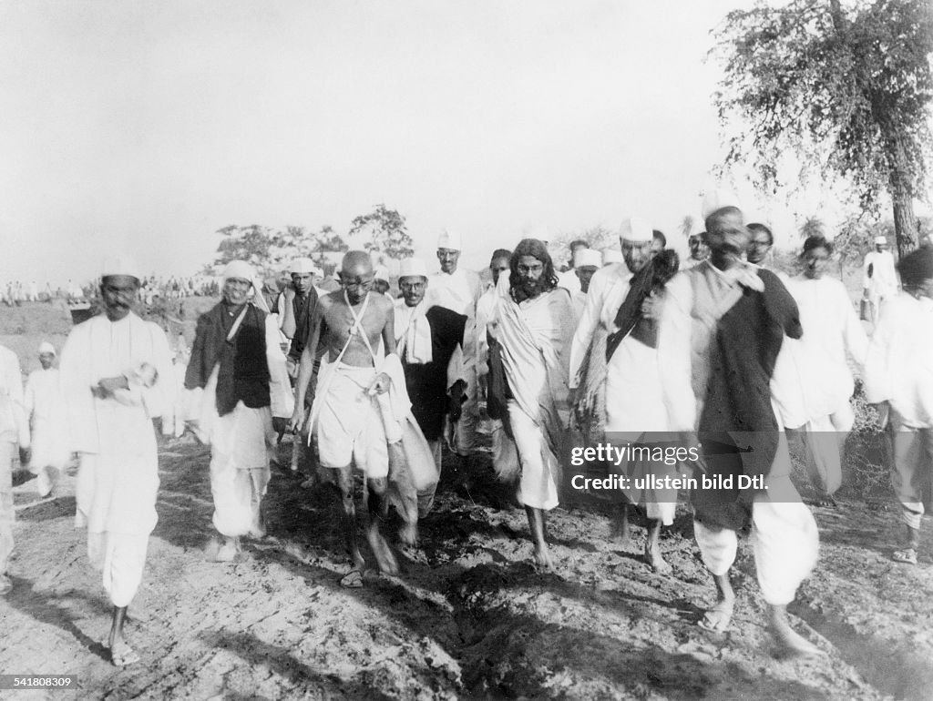 MOHANDAS GANDHI (1869-1948). Hindu nationalist and spiritual leader. On the Salt March, 1930.