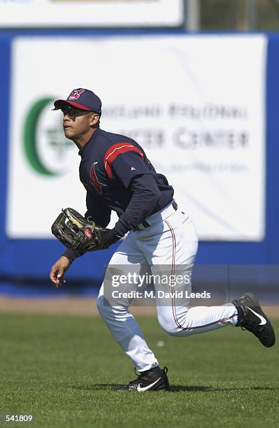 Alex Escobar of the Cleveland Indians fields the ball during the spring training game against the Minnesota Twins at Chain of Lakes Park in Winter...