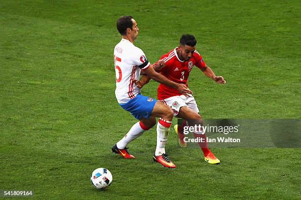 Neil Taylor of Wales and Roman Shirokov of Russia compete for the ball during the UEFA EURO 2016 Group B match between Russia and Wales at Stadium...