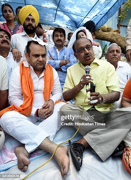 Rajya Sabha MP Vijay Goel joins Bharatiya Janata Party MP Mahiesh Girri during his indefinite fast outside the residence of Delhi Chief Minister...