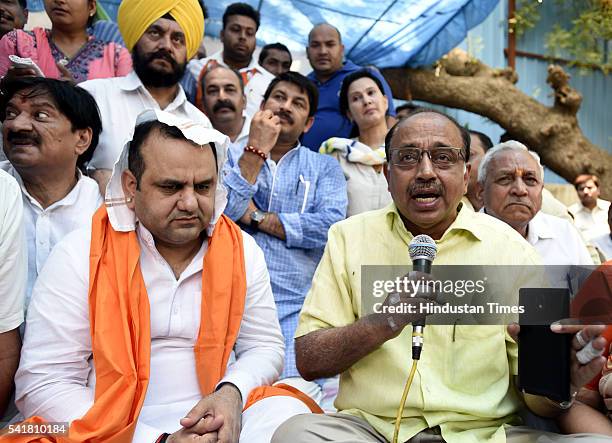 Rajya Sabha MP Vijay Goel joins Bharatiya Janata Party MP Mahiesh Girri during his indefinite fast outside the residence of Delhi Chief Minister...