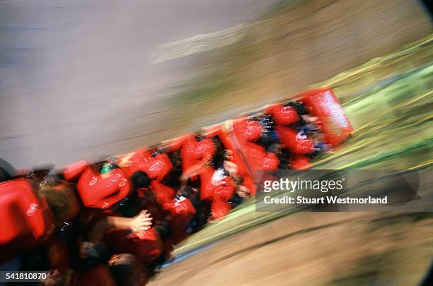 speeding roller coaster - achterbahn stock-fotos und bilder