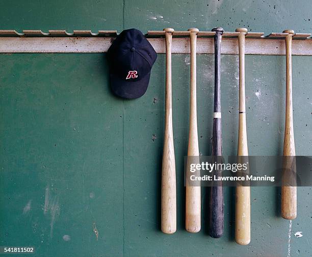 baseball bats and hat hanging - baseball bat ストックフォトと画像