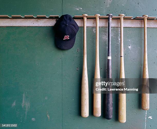 baseball bats and hat hanging - baseball bats stock pictures, royalty-free photos & images