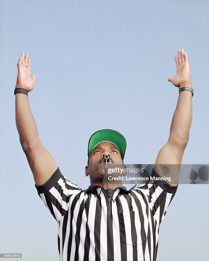 Football Referee Signalling Touchdown