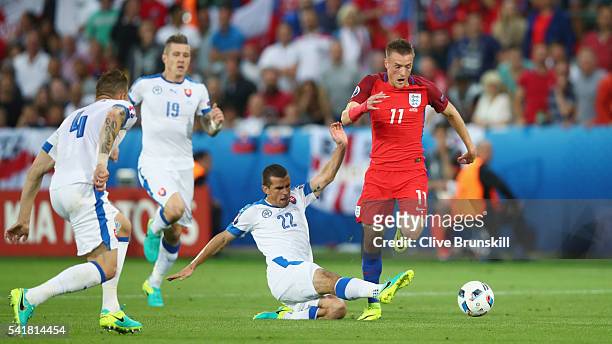 Jamie Vardy of England is tackled by Viktor Pecovsky of Slovakia during the UEFA EURO 2016 Group B match between Slovakia and England at Stade...