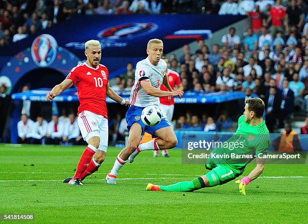 Wales's Aaron Ramsey scores the opening goal during the UEFA Euro 2016 Group B match between Russia v Wales at Stadium de Toulouse on June 20 in...