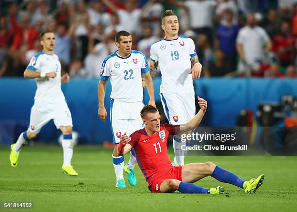 Jamie Vardy of England reacts after fouled by Viktor Pecovsky of Slovakia resulting in an yellow card during the UEFA EURO 2016 Group B match between...