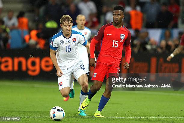 Tomas Hubocan of Slovakia and Daniel Sturridge of England compete during the UEFA EURO 2016 Group B match between Slovakia and England at Stade...