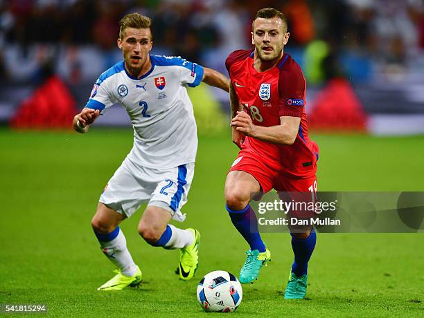 Jack Wilshire of England and Peter Pekarik of Slovakia compete for the ball during the UEFA EURO 2016 Group B match between Slovakia and England at...