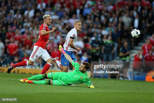 Aaron Ramsey of Wales in action against Igor Smolnikov and goalkeeper Igor Akinfeev of Russia during the UEFA EURO 2016 Group B match between Russia...