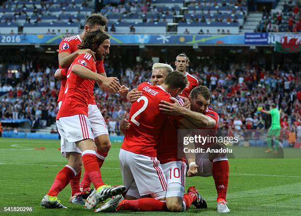 Players of Wales celebrate after scoring a goal during the UEFA EURO 2016 Group B match between Russia and Wales at Stadium Municipal in Toulouse,...